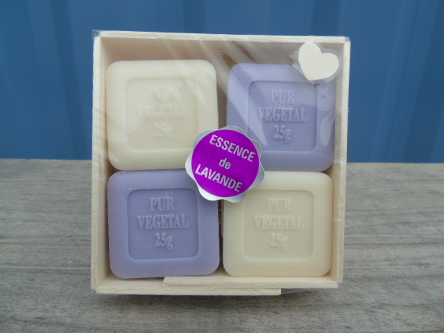 Four white and purple lavender soaps for guests